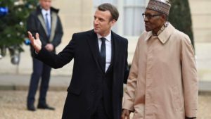 President Buhari welcome to the Summit in Paris by France's Emmanuel Macron
