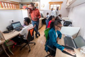 PanAfricaProject: Sam Wanjohi in the office with his team at Popote